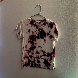 A pink and white tie die shirt